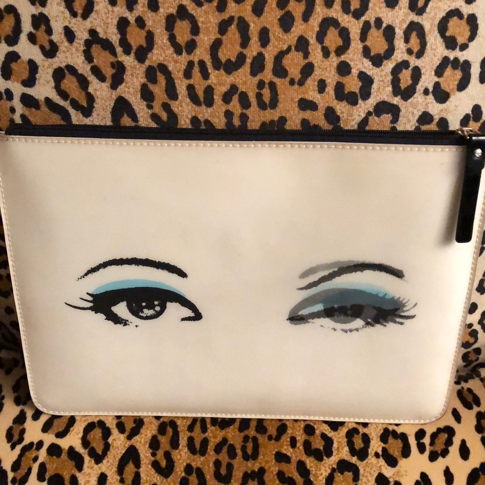 Kate Spade thin clutch that winks back!